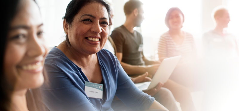 East Midlands Councils homepage banner of a lady talking at a meeting